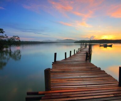 a wooden pier going out into a lake representing retirement